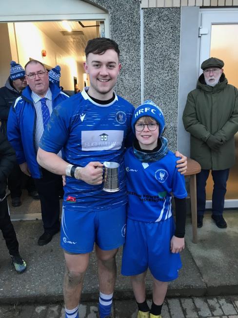 Jack Evans and Jamie Sanders, with Alun Wills and Charles Davies (president) in the back ground